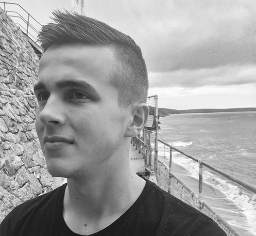 Bruno, cutting hair on the seaside in Porthleven, Cornwall