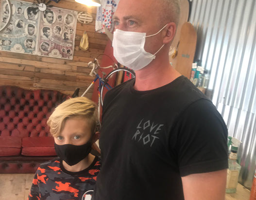 Bruno, cutting hair on the seaside in Porthleven, Cornwall