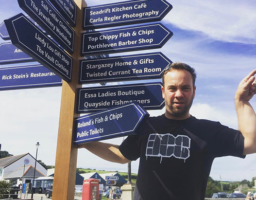 Bruno, cutting hair on the seaside in Porthleven, Cornwall